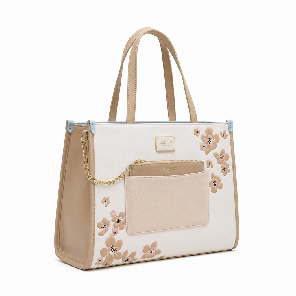 Emily Loran Tote Bag with white body, beige sides and handles, floral print, and gold hardware.