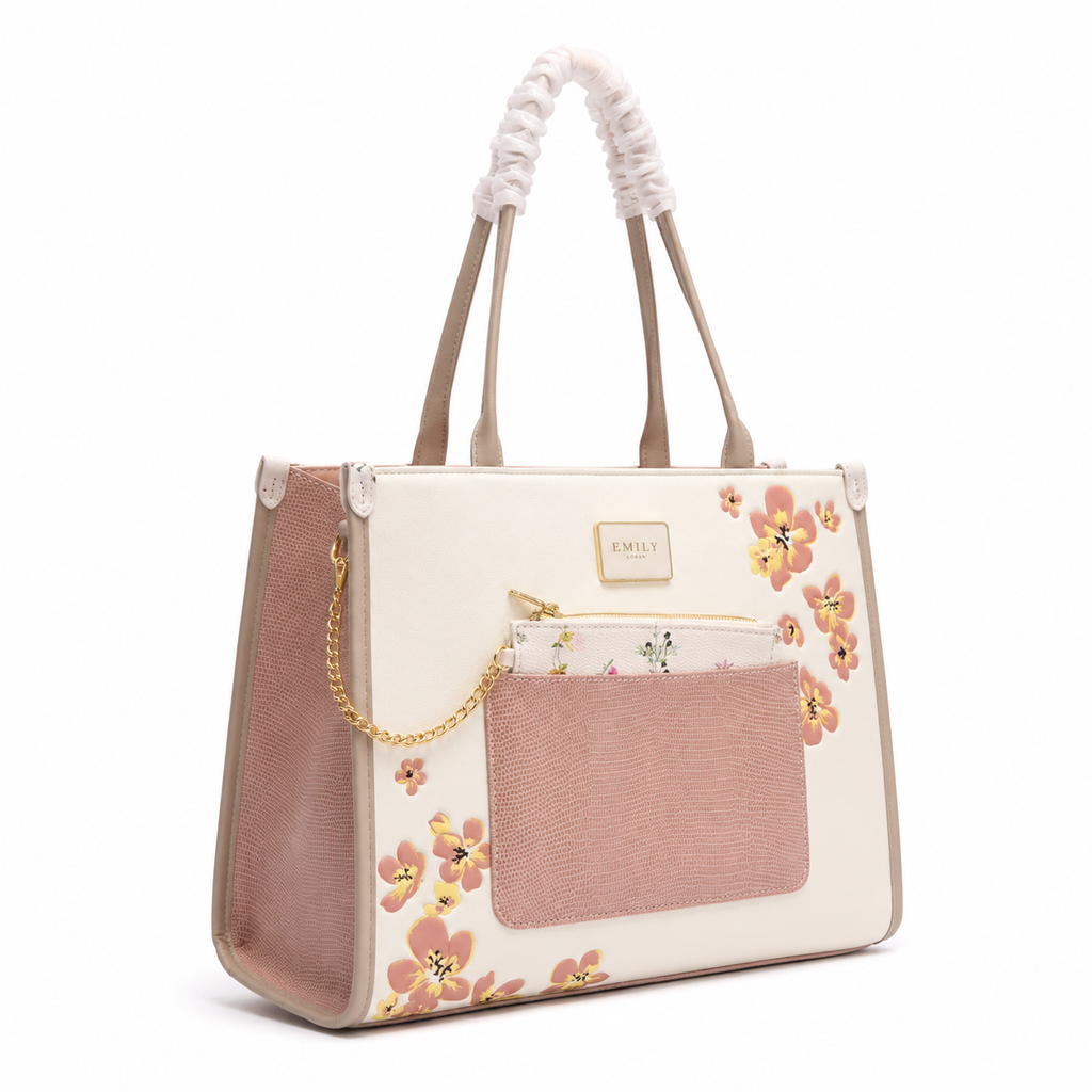Emily Loran Tote Bag: cream body with pink panels and floral print, front pocket, and gold chain detail.